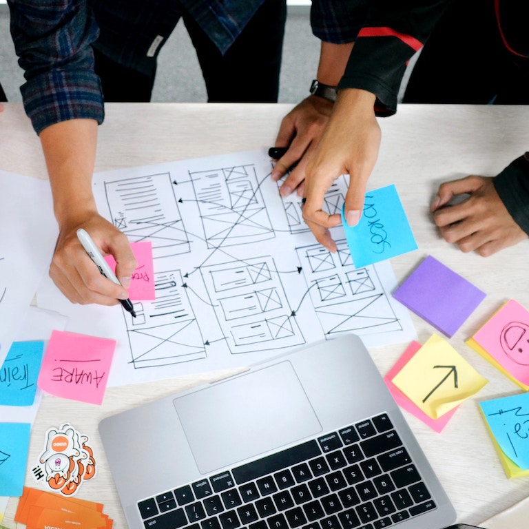 Laptop with Post-Its on Desk